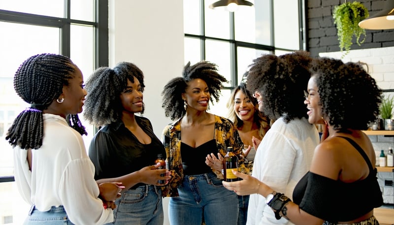 Natural hair care professionals collaborating at an Illinois event Natural hair care professionals collaborating at an Illinois event